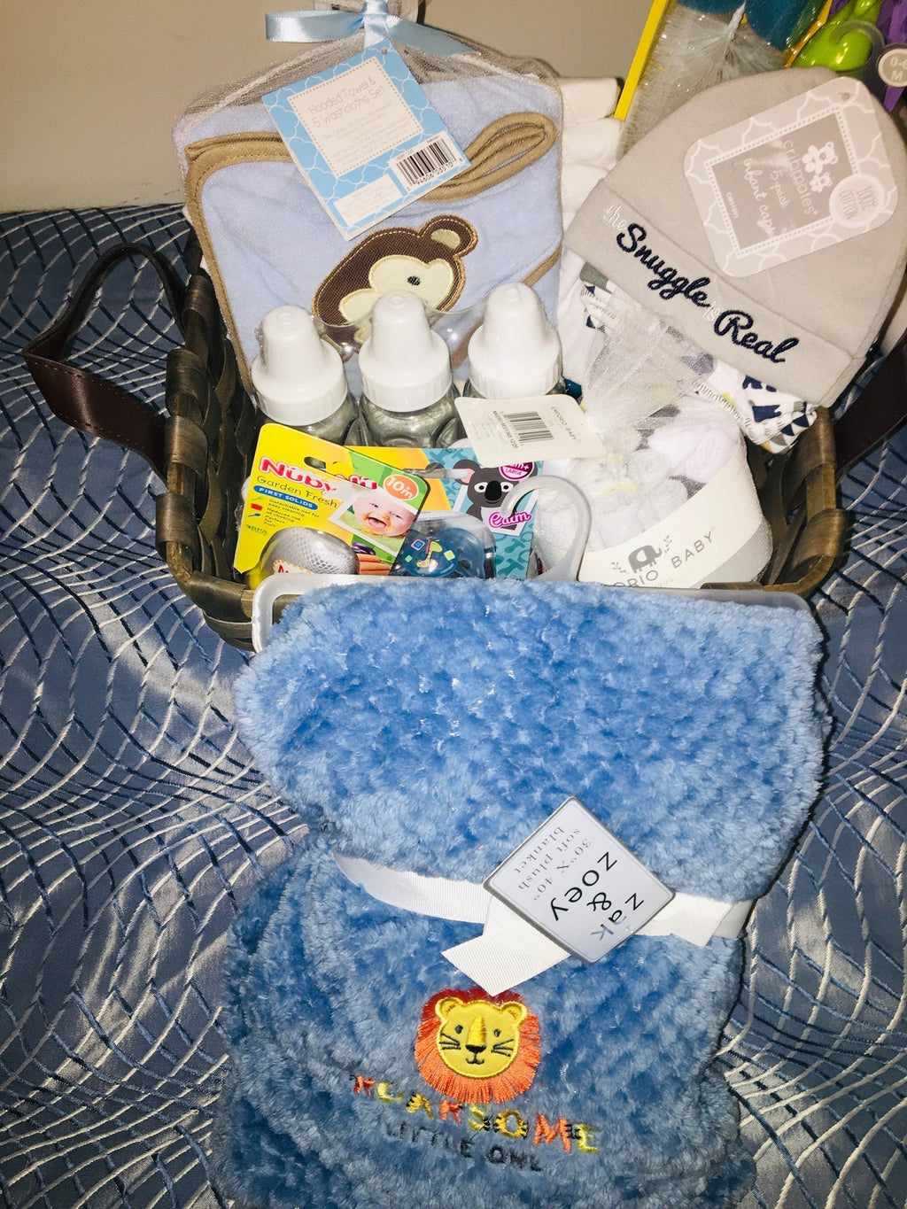 Customized- to-order Baby shower gift basket for boys with toys and essentials.