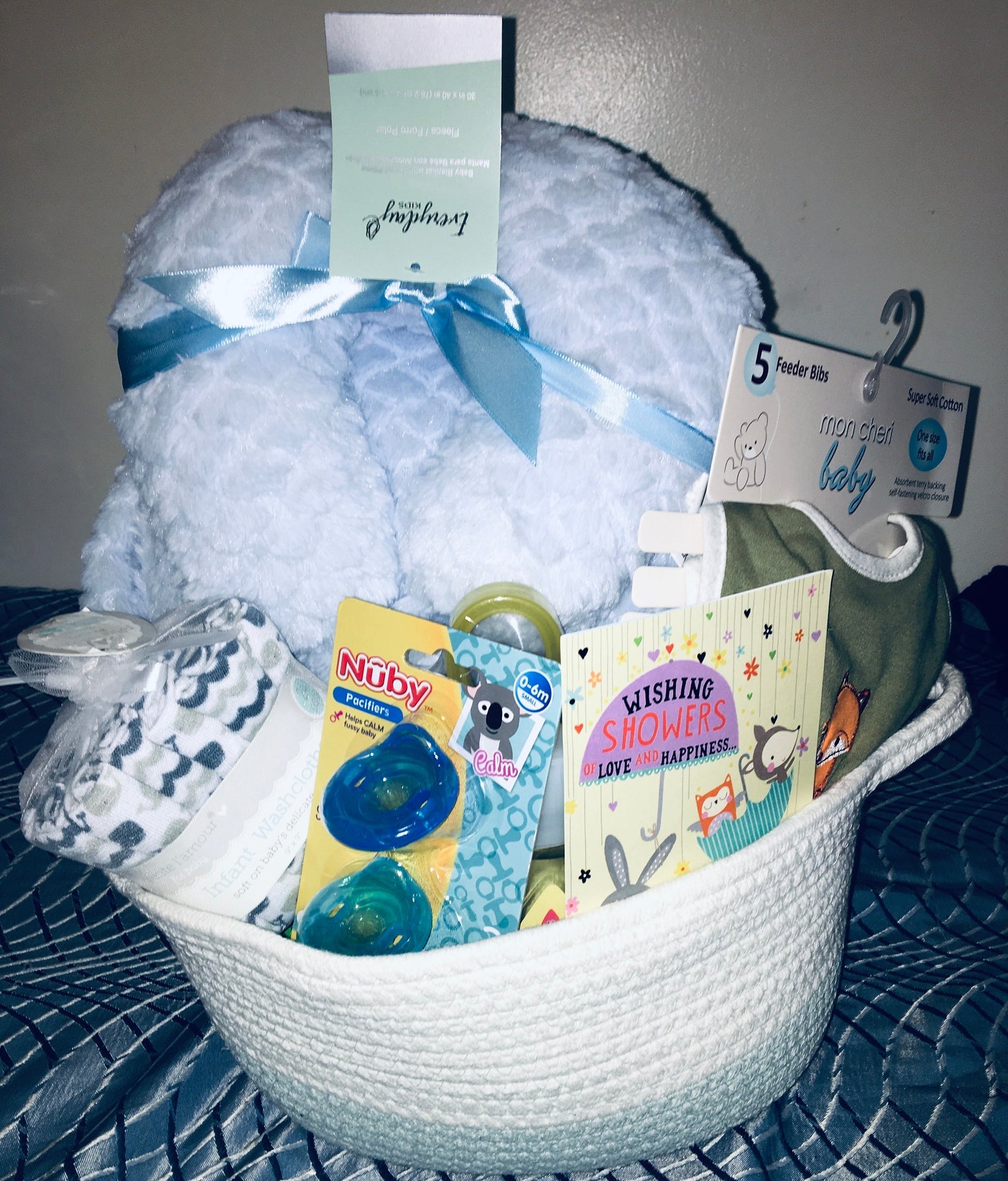 Customized- to-order Baby shower gift basket for boys with toys and essentials.