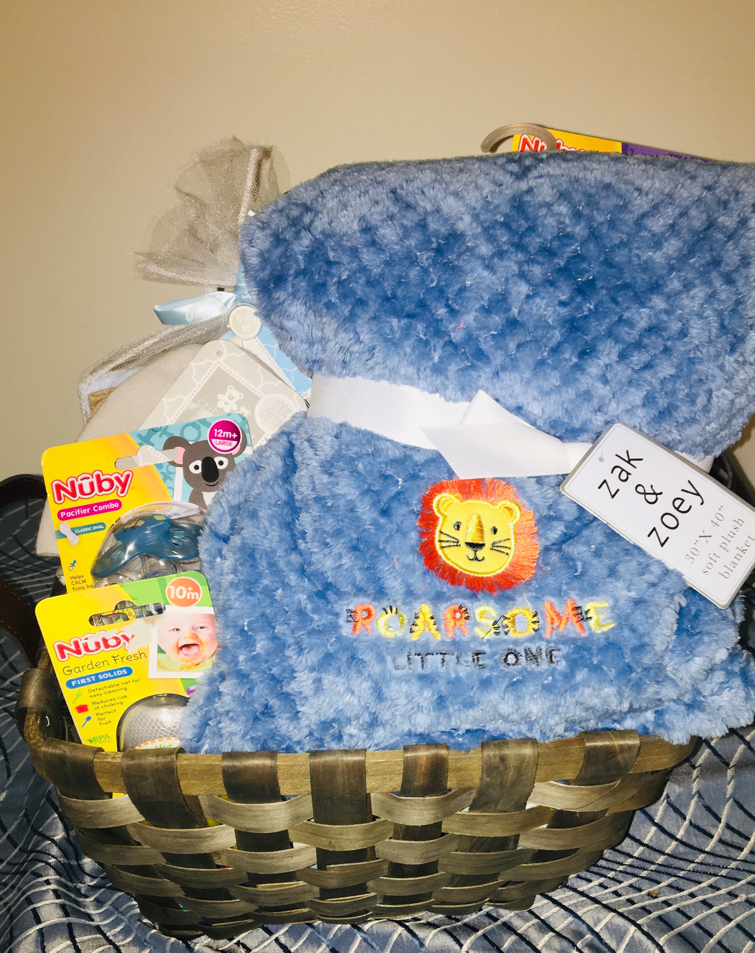 Customized- to-order Baby shower gift basket for boys with toys and essentials.