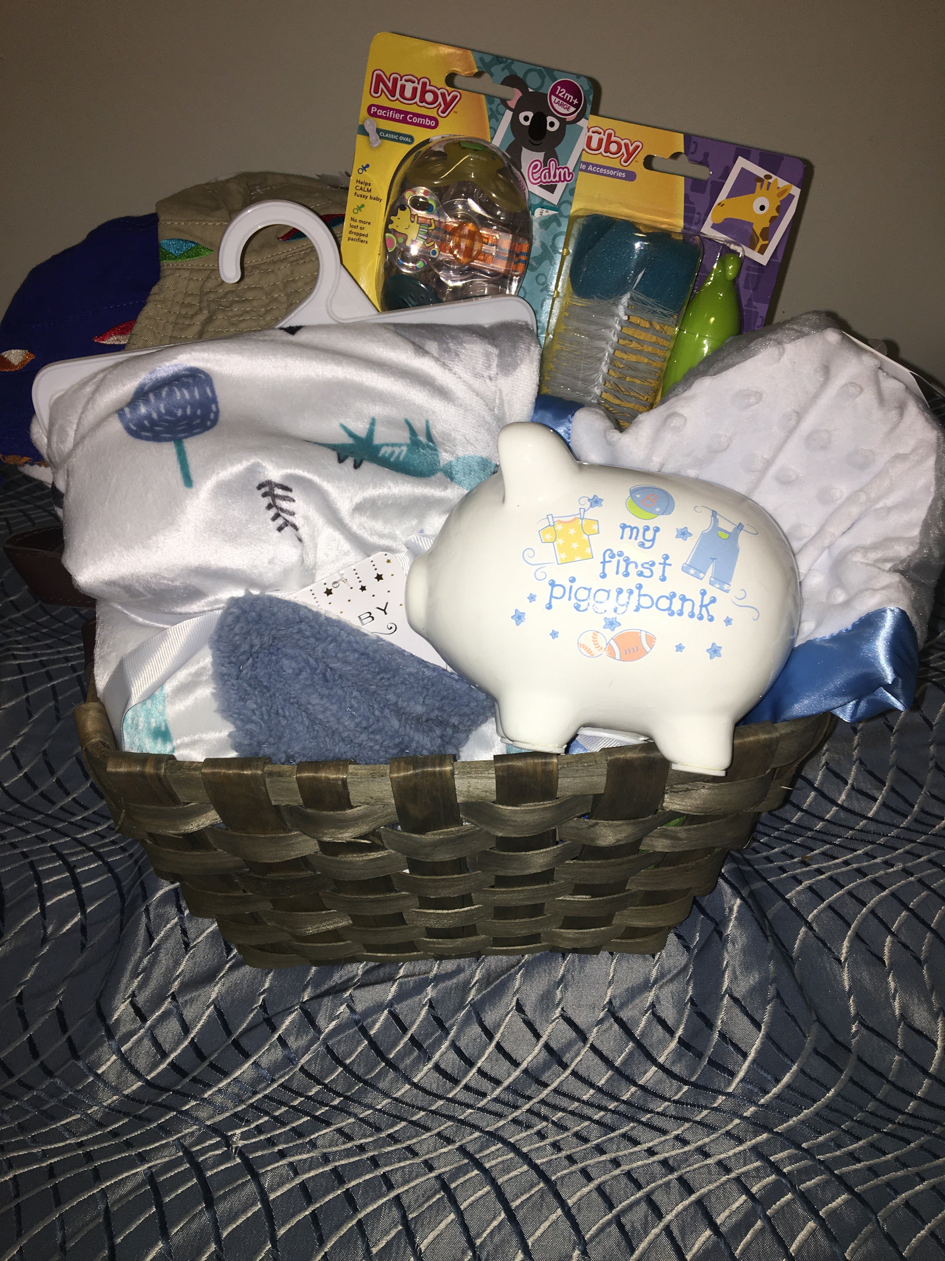 Customized- to-order Baby shower gift basket for boys with toys and essentials.